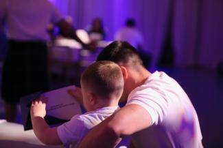 dad and son sitting together