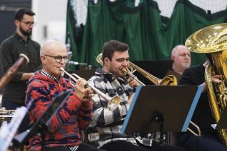 Three men playing instruments