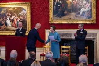 Prison Officer receiving award from Princess Anne