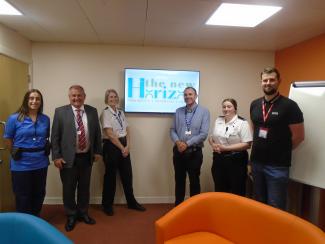 Group of staff opening new area within prison
