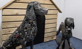 statues of dogs made from scrap metal